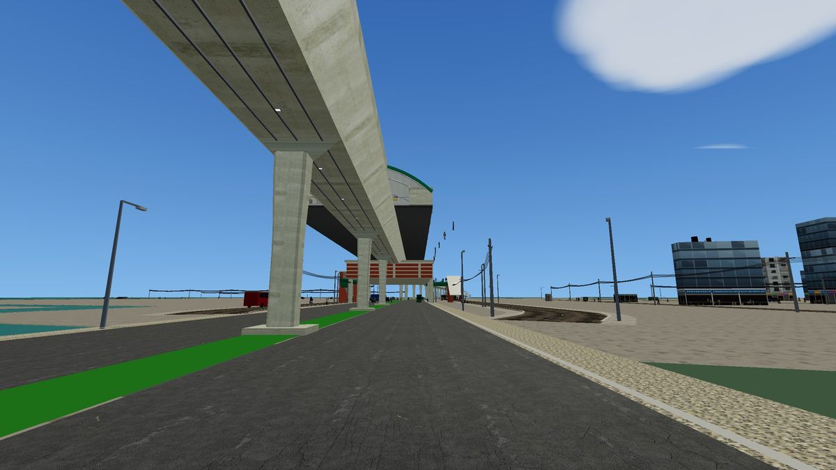 Uttara South station on the MRT Line 6 viaduct with open ground around it in Mirpur Drive